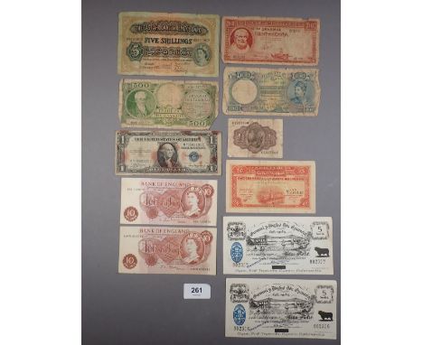 A wad of world banknotes including: (2) Bank of England 10 shillings prefix: 08A J.Q.Hollom and A94N J.S.Fforde (2) provincia