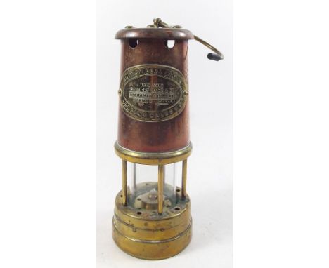 A copper and brass mining lamp