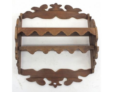 An antique oak wall shelf with carved decoration, 59.5cm x 48.5cm 