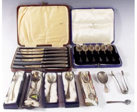 A set of six silver dog nose teaspoons, Sheffield 1929, a set of six silver handled tea knives, six silver commemorative teas