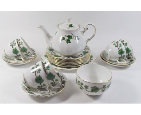 A Crown Staffordshire part tea service printed vine leaves comprising six cups and five saucers, cake plate, six tea plates, 