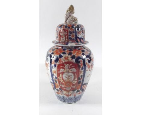 A Japanese Imari vase and cover with dog of Fo to finial (chipped to rim), 29cm high 