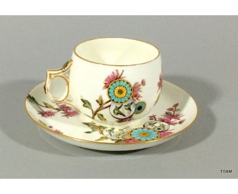 A George Jones Designed cup and saucer bearing the lozenge marks for 1883