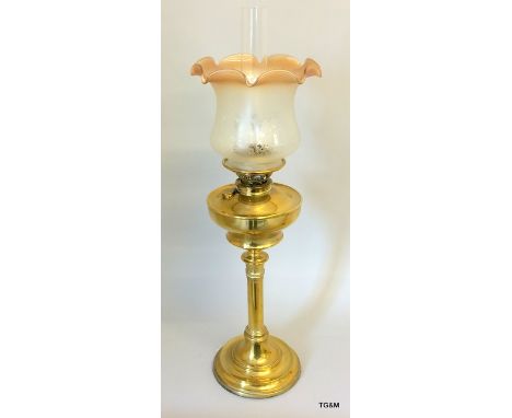A brass oil lamp complete with flue