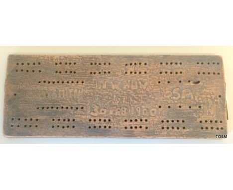 A Boer War trench art hand made cribbage board 28cms x 11 cms with carved onto the top TW Huw Ladysmith SA 30 Feb 1900