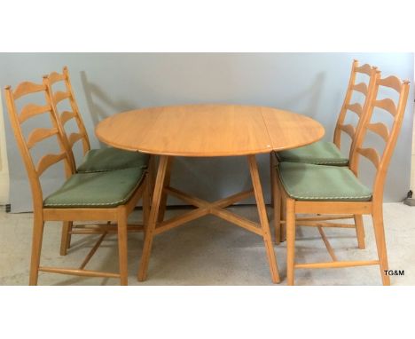 A round Ercol blond elm  table with folding side & 4 chairs