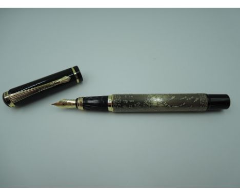 A Baoer Eight Horses fountain pen, circa 2000 in green antique overlay, medium nib, piston fill, made in China