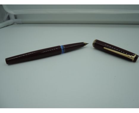 A Montblanc 22 fountain pen, circa 1950, Burgundy ink vue, piston fill, good condition, made in Germany