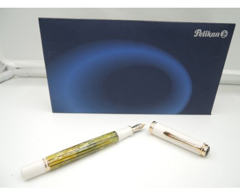 A boxed Pelikan Fountain pen, circa 1986, Green and Brown stiated, fine nib, piston fill, made in Germany, 