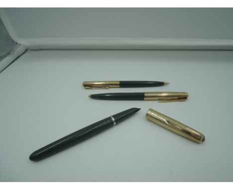 A Parker 51 fountain pen pencil and ballpoint pen set, circa 1959, Navy Grey with rolled gold cap, medium nib, aeromatic, mad