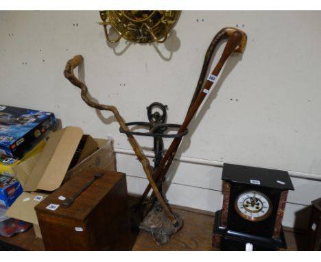     Three Vintage Wooden Walking Sticks, Together With A Cast Metal Stick Stand     