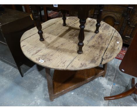     An Early Circular Topped Pine Cricket Table With Base Shelf                     