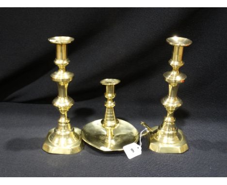 A Pair Of Antique Brass Candle Holders, Together With A Brass Chamber Stick