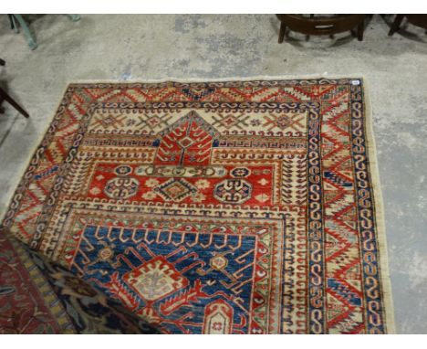     A Blue &amp; Red Ground Patterned Carpet, 98 X 70"                                  