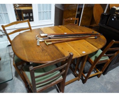     A Mid 20th Century Oak Gate Leg Dining Table, Together With A Set Of Four Ladder Backed Chairs                           