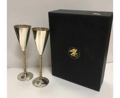 A pair of Stuart Devlin silver and gilt goblets of conical form bearing Senior Falcon crest to exterior, housed in presentati