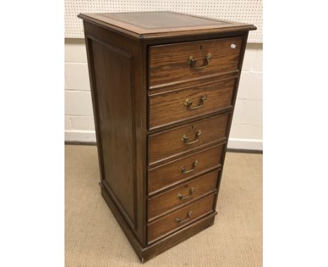 A mahogany glazed hanging corner cabinet, 77 cm wide x 95.5 cm high, a modern oak filing cabinet of three long drawers as a c