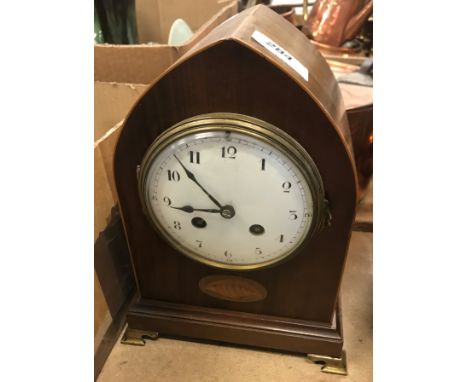 An Edwardian mahogany inlaid mantel clock of lancet form, 25 cm high, together with a German 365 day Rotary pendulum mantel c