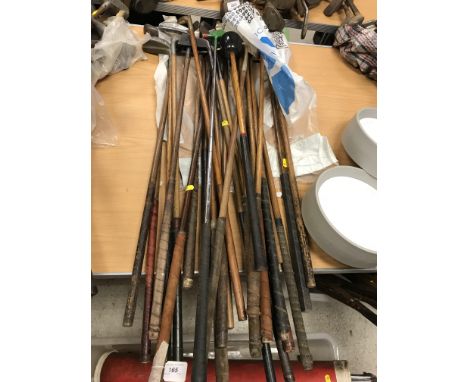 A collection of twenty-five various hickory shafted and other golf clubs, mainly putters, including "The F Murray Patent 9437