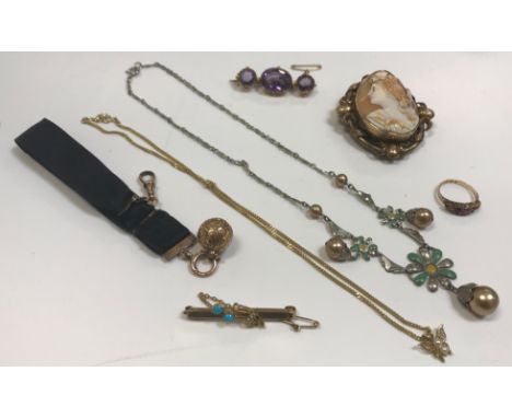 A collection of costume jewellery to include a 9 carat gold ruby and emerald set dress ring, a 15 carat gold seed pearl and t
