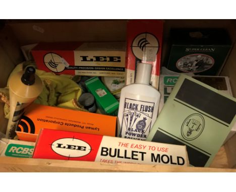Two boxes of various ammunition making and cleaning equipment including patches and other cleaning materials, lead balls, bla