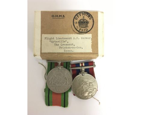 Two Second World War medals comprising the Defence Medal and the War Medal, both with ribbons, in the original box addressed 