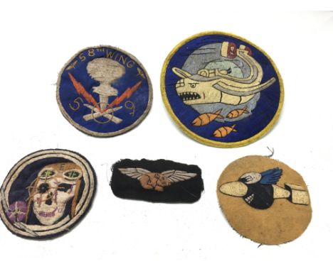 A World War 2 Guinea pig Club RAF uniform badge patch for aircrew burnt together with with 4 USAAF American Airforce patches,