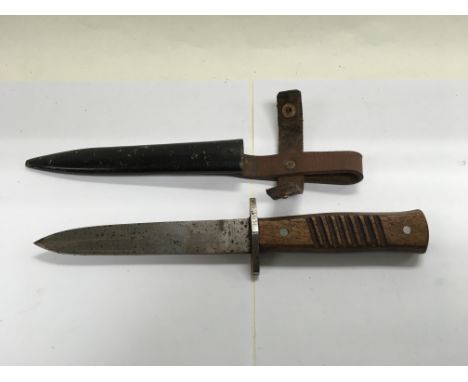 A German fighting dagger and scabbard stamped solingen and Rregt 85, possibly WW1.