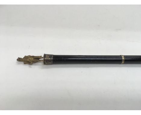 An admirals swagger stick surmounted with a gilt figure of a naval officer figure.