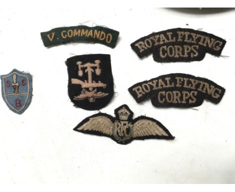 A rare SBS Special boat service cloth beret badge together with V Commando shoulder title, WW1 RFC Royal Flying Corps shoulde