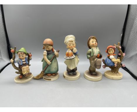 Five Goebel Hummel Figures to include Apple Tree Boy, Little Sweeper, Baker, Traveller, and Apple Tree Girl