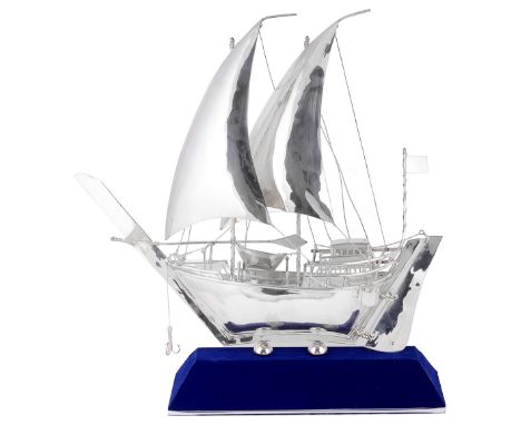A MODEL OF A DHOW  PERSIAN GULF  MODERN the twin masted vessel with prominent prow  stamped ‘925’  on a blue velvet canted st