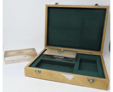 A PAIR OF SILVER CIGARETTE BOXES  S.J. ROSE &amp; SON  LONDON  1964 rectangular  the lids engine-turned around a coat of arms
