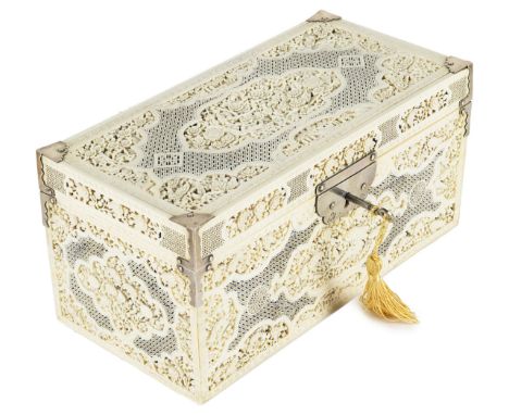 ˜A CHINESE IVORY TEA CADDY CASKET CANTON CIRCA 1750 rectangular finely carved and pierced with shaped panels and spandrels fi