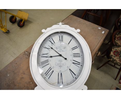 An oversized wall clock in pocket watch form