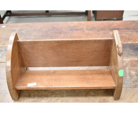 An Arts and Crafts 'Mouseman' golden oak book trough having typical mouse carved to edge