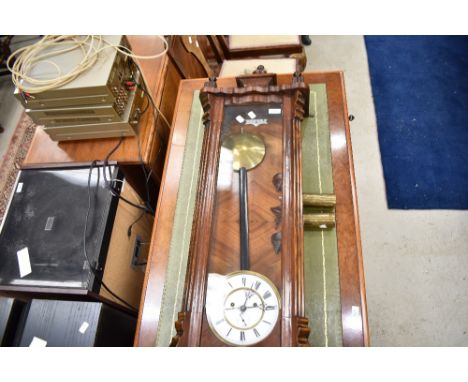 A traditional mahogany cased Vienna wall clock