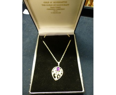 A GUILD OF HANDICRAFT AMETHYST AND SEED PEARL SET OPENWORK PENDANT ON CHAIN. LONDON 2001