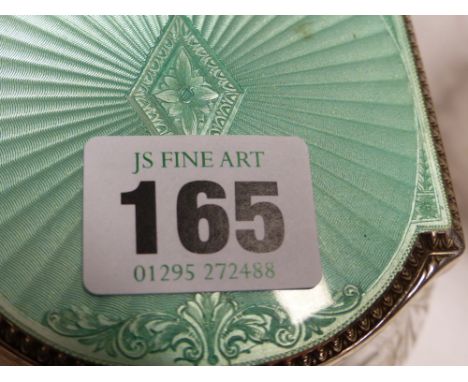 A SILVER MOUNTED CUT GLASS POWDER JAR WITH GUILLOCHE GREEN ENAMEL LID. BIRMINGHAM 1929 TOGETHER WITH A STERLING SILVER MOUNTE