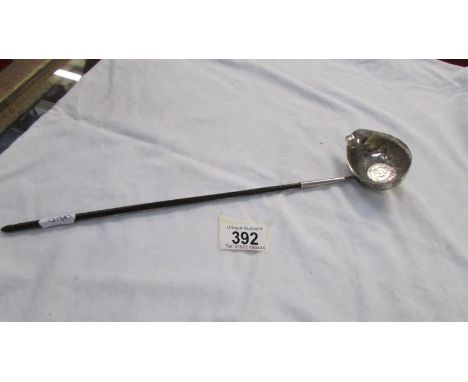 A Georgian silver plate wine ladle/taster with coin inset to base.