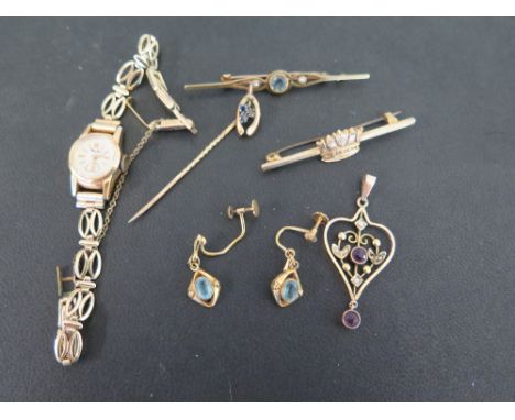 An assortment of items - To include an amethyst and seed pearl pendant - A stickpin with sapphire trefoil -  A crown bar broo