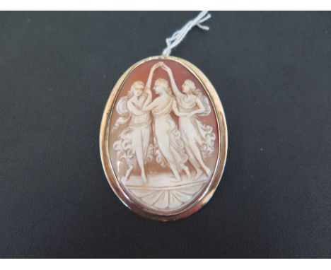 A shell cameo pendant/brooch - Depicting ladies dancing, within aplain 9ct gold surround - Hallmarked Sheffield - Length 7.5c