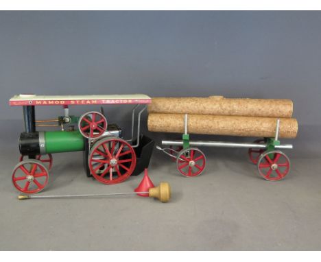 A Mamod TEIA traction engine, with white canopy, burner and steering rod and a Mamod LW1 Lumber Wagon complete with three tru