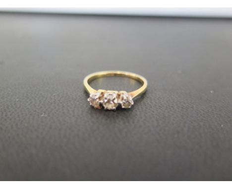 A graduated diamond three-stone ring - Stamped 18ct - Ring size L 1/2 - Weight approx 2.2gms
Condition Report: Good - With li