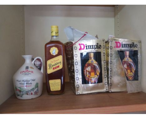 A bottle of Brandaberg Rum, a ceramic bottle of The Edradour single Highland Malt whisky and two bottles of 1982 Dimple Haig 