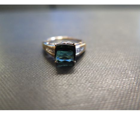 An 18ct gold indicolite tourmaline and diamond dress ring - Hallmarked Birmingham - Ring size O - Weight approx 4.4gms
Condit