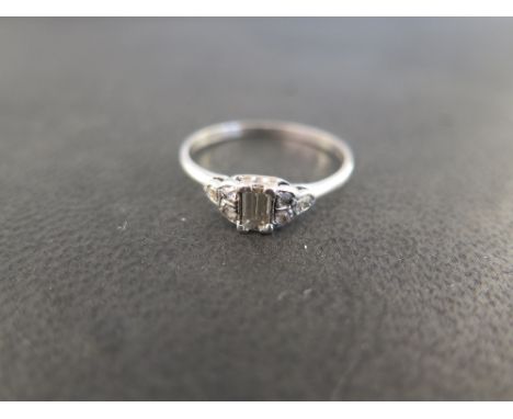 A diamond dress ring - The rectangular-shape diamond to the rose-cut diamond trefoil shoulders and plain band - Principal dia