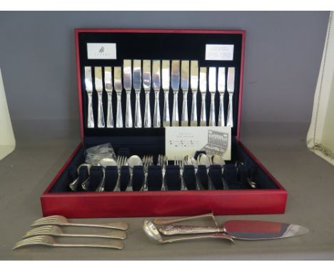 A Fifty eight piece canteen of cutlery by Viners, a silver hallmarked handle cake knife, a ladle, a pusher and three forks al