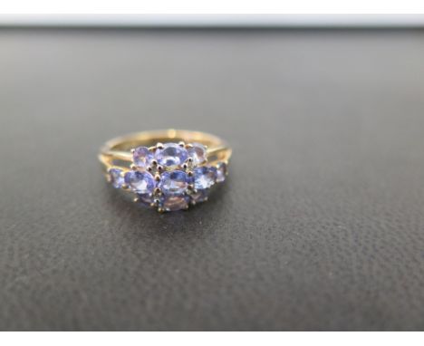 A 9ct gold tanzanite and diamond dress ring - Hallmarked Birmingham - Ring size K - Weight approx 2.1gms
Condition Report: Go