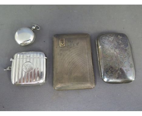 A good silver vesta and a silver sovereign case and two silver cigarette cases - the vesta with pinstripe decoration hallmark